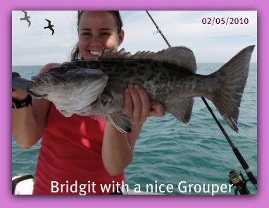 Lady angler catches Grouper on Fat Cat fishing charters.