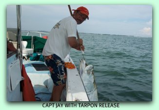 Capt Jay in the gulf of Mexico with a nice Tarpon.